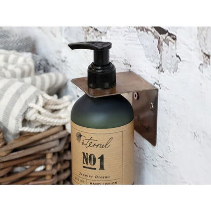 Vægophæng til Éternel Dispenser 250 ml – Antique Messing - Giv dine plejeprodukter en elegant plads med dette vægophæng til Éternel dispenser 250 ml.